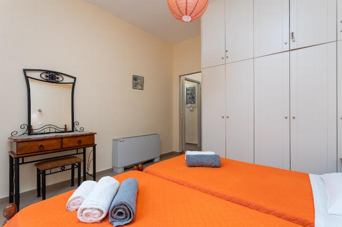 Twin bedroom with ensuite bathroom and A/C . - Villa Konstantinos . (Photo Gallery) }}