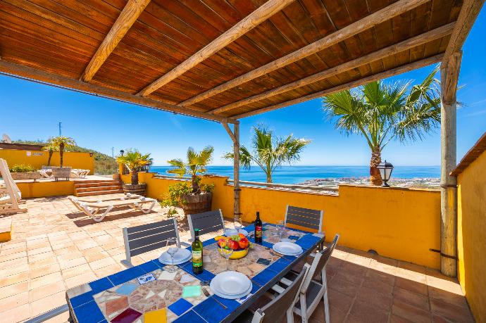 Sheltered terrace area with sea views . - Villa Benizan . (Photo Gallery) }}