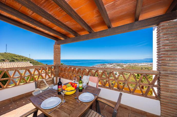 Sheltered terrace area with sea views . - Villa Benizan . (Photo Gallery) }}