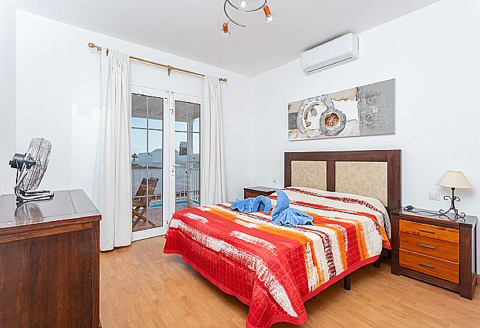 Double bedroom with en suite bathroom, A/C, and terrace access . - Villa Candela . (Photo Gallery) }}