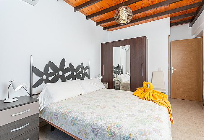 Double bedroom with en suite bathroom, A/C, and terrace access . - Villa Tropical . (Photo Gallery) }}