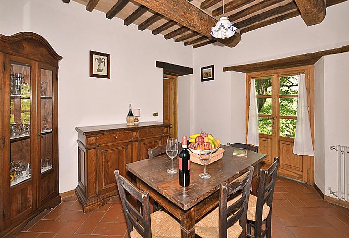 Living room with sofas, dining area, ornamental fireplace, and satellite TV . - Villa Piombona . (Галерея фотографий) }}