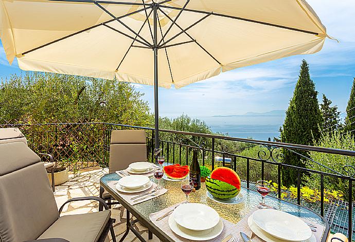 Terrace area with sea views . - Villa Evie . (Photo Gallery) }}