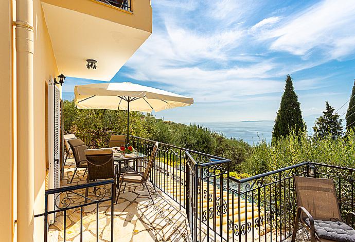 Terrace area with sea views . - Villa Evie . (Photo Gallery) }}