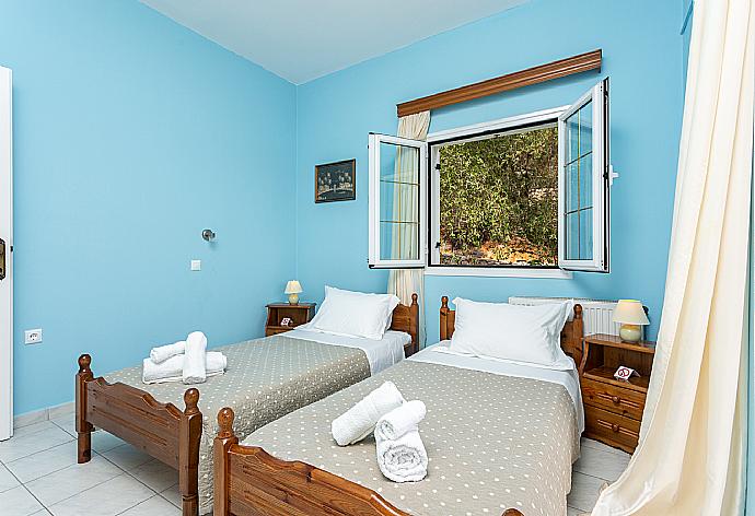 Twin bedroom with A/C and balcony . - Villa Evie . (Photo Gallery) }}