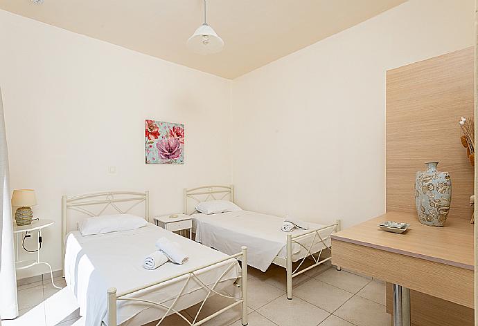 Twin bedroom with en suite bathroom, A/C, and upper terrace access with panoramic sea views . - Villa Georgia . (Галерея фотографий) }}