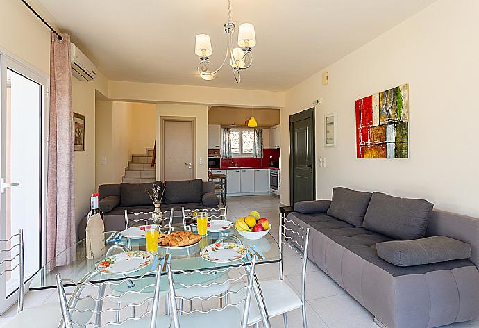 Open-plan living room with sofas, dining area, kitchen, A/C, WiFi internet, and satellite TV  . - Villa Eri . (Galleria fotografica) }}