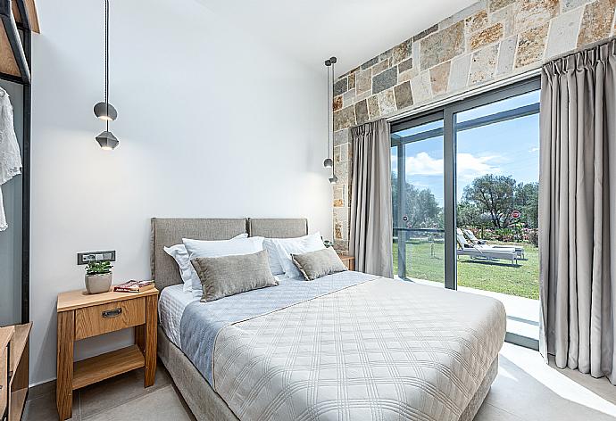 Double bedroom with en suite bathroom, A/C, and terrace access . - Villa Angelos . (Photo Gallery) }}