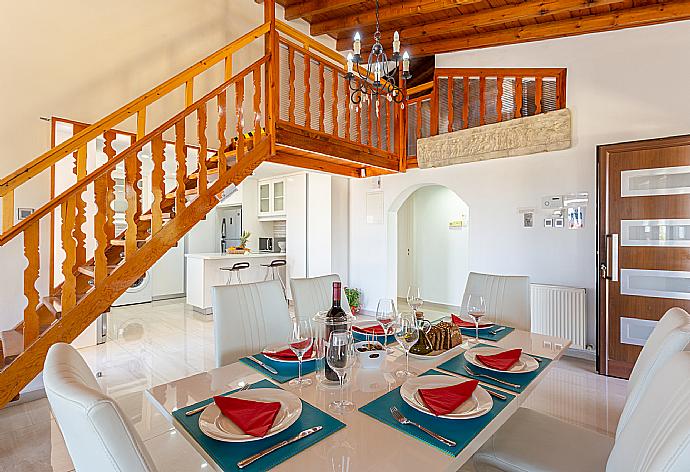 Open-plan living room with sofas, dining area, kitchen, ornamental fireplace, mezzanine, WiFi internet, and TV . - Villa Stone House . (Fotogalerie) }}