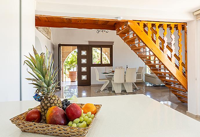 Open-plan living room with sofas, dining area, kitchen, ornamental fireplace, mezzanine, WiFi internet, and TV . - Villa Stone House . (Galería de imágenes) }}