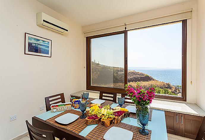 Dining area with A/C and sea views . - Villa Mermaid . (Photo Gallery) }}