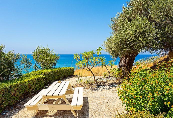 Garden area with panoramic sea views . - Villa Mermaid . (Photo Gallery) }}