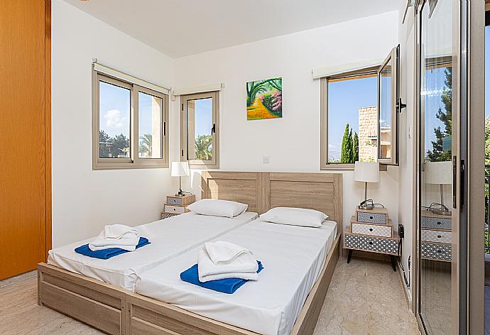 Twin bedroom with en suite bathroom, A/C, and upper terrace access . - Villa Izabella . (Photo Gallery) }}