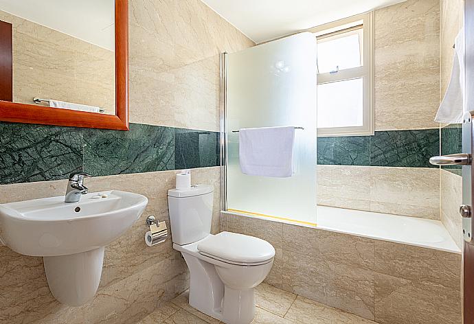 En suite bathroom with bath and shower . - Villa Diana . (Photo Gallery) }}