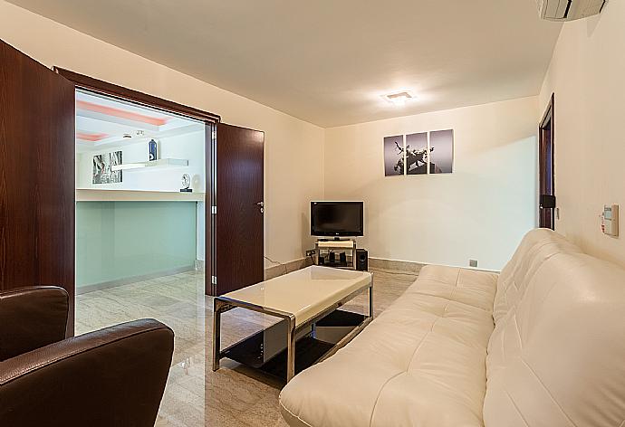 Living area with TV and A/C . - Villa Galene . (Photo Gallery) }}