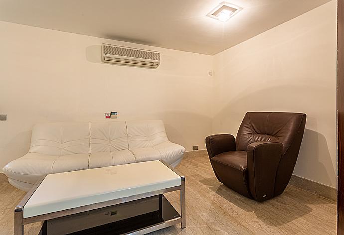 Living area with TV and A/C . - Villa Galene . (Photo Gallery) }}