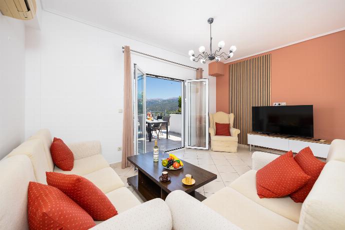 Open-plan living room with sofas, dining area, kitchen, A/C, WiFi internet, and satellite TV . - Villa Europe Ena . (Photo Gallery) }}