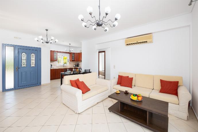 Open-plan living room with sofas, dining area, kitchen, A/C, WiFi internet, and satellite TV . - Villa Europe Ena . (Photo Gallery) }}
