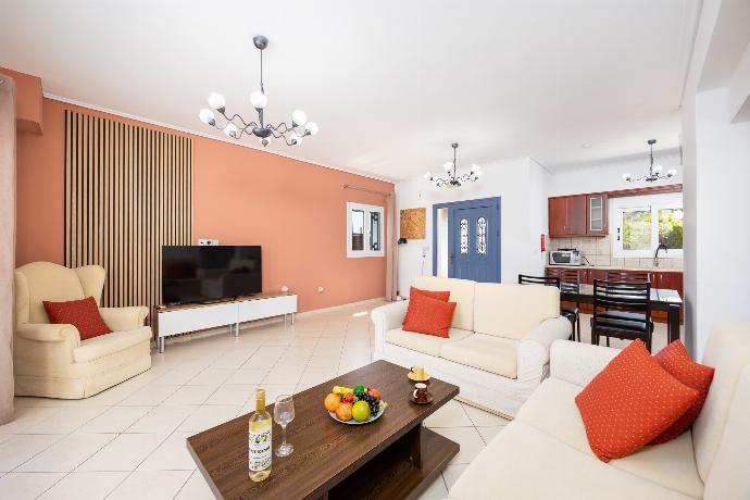 Open-plan living room with sofas, dining area, kitchen, A/C, WiFi internet, and satellite TV . - Villa Europe Ena . (Photo Gallery) }}