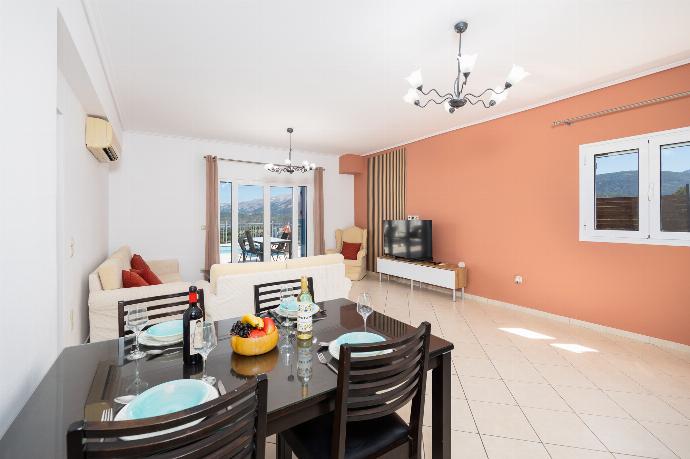 Open-plan living room with sofas, dining area, kitchen, A/C, WiFi internet, and satellite TV . - Villa Europe Ena . (Photo Gallery) }}