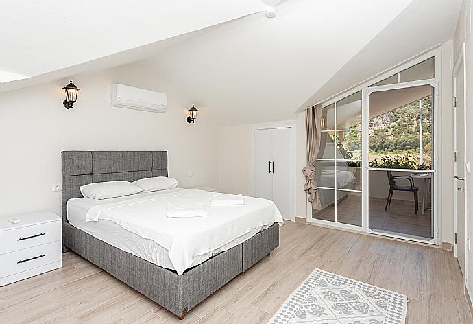 Double bedroom with A/C and upper terrace access . - Villa Zonkdemir . (Photo Gallery) }}