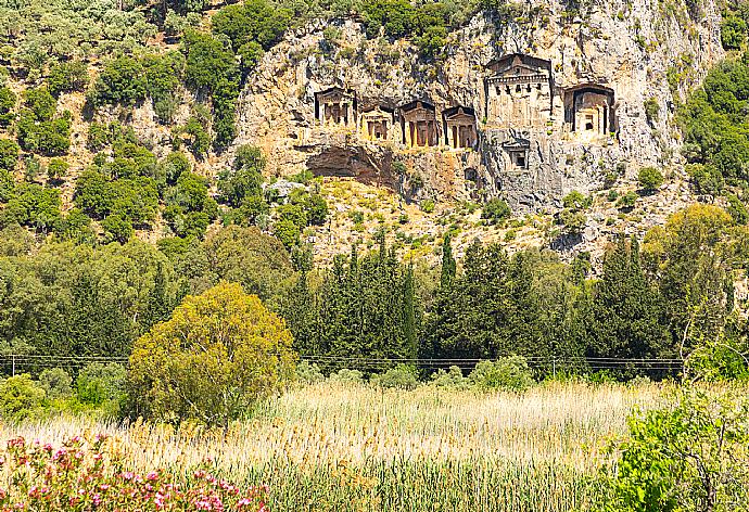 View of the ancient Lycian rock tombs from upper terrace . - Villa Zonkdemir . (Photo Gallery) }}