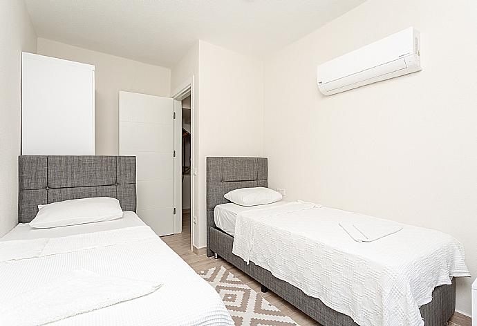 Twin bedroom with A/C and pool terrace access . - Villa Zonkdemir . (Photo Gallery) }}