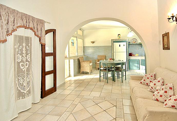 Open-plan living room with sofas, dining area, kitchen, WiFi internet, satellite TV, and terrace access . - Villa Aster . (Fotogalerie) }}