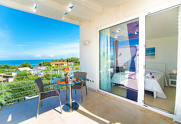 Upper terrace area with sea views . - Villa Orchidea . (Photo Gallery) }}