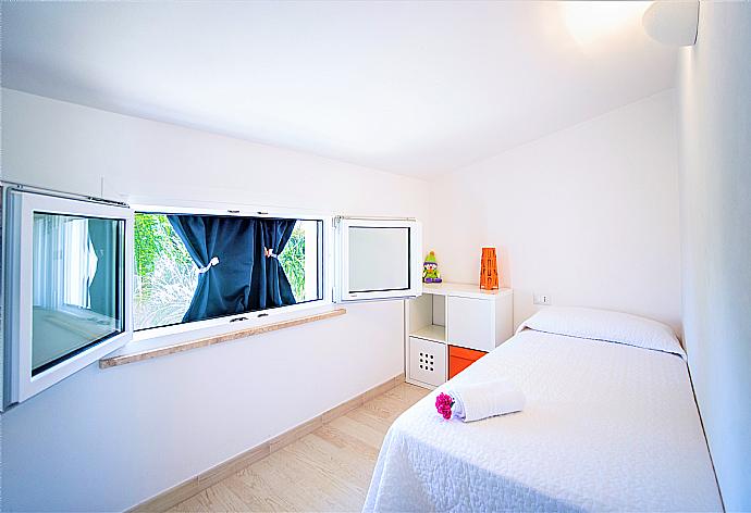 Single bedroom with A/C . - Villa Orchidea . (Photo Gallery) }}