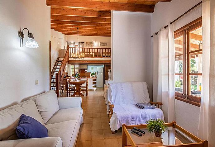 Open-plan living room with sofas, dining area, kitchen, mezzanine, A/C, WiFi internet, and satellite TV . - Villa Eternidad . (Photo Gallery) }}