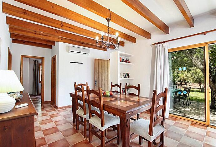 Living room with sofas, dining area, ornamental fireplace, A/C, WiFi internet, and satellite TV . - Villa Angel . (Photo Gallery) }}