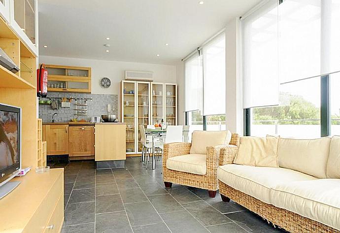 Open-plan living room with sofas, dining area, kitchen, A/C, WiFi internet, and satellite TV . - Villa Can Paco . (Галерея фотографий) }}