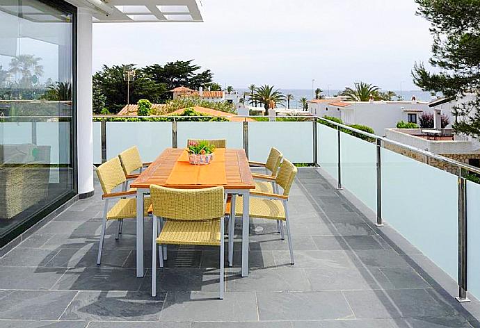 Upper terrace area with sea views . - Villa Can Paco . (Photo Gallery) }}