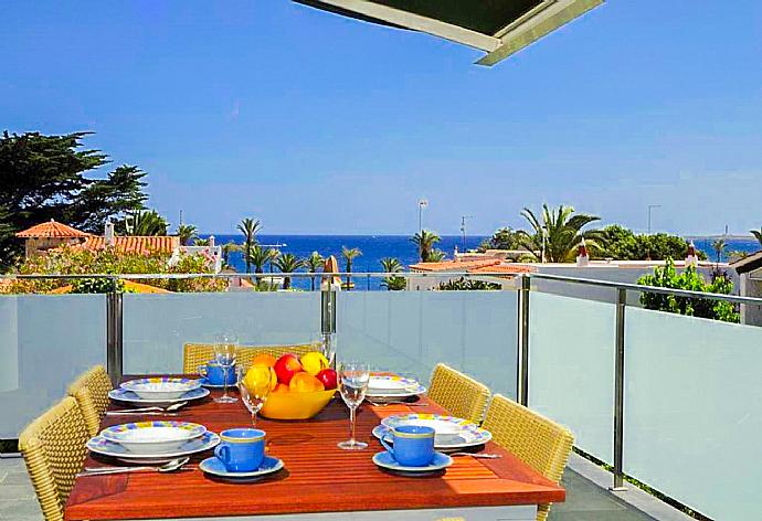 Upper terrace area with sea views . - Villa Can Paco . (Photo Gallery) }}