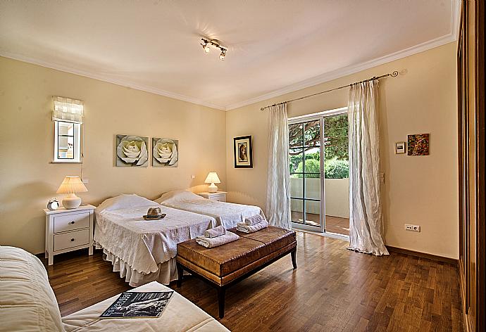 Twin bedroom with balcony access and en-suite bathroom. . - Villa Bela Vista . (Photo Gallery) }}