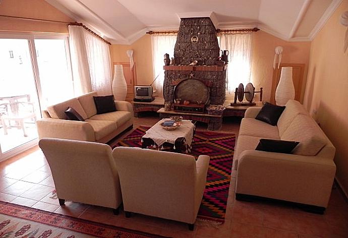 Living room with ornamental fireplace . - Dalyan Palace . (Photo Gallery) }}