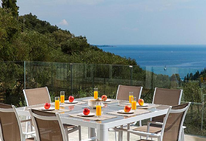 Outdoor dining table with sea view . - Villa Rana . (Photo Gallery) }}