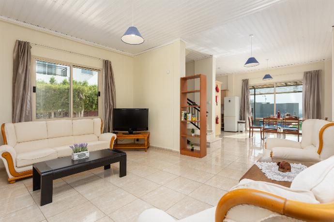 Open-plan living room on ground floor with sofa and seats, dining area, kitchen, WiFi internet, satellite TV, and sea views . - Villa Solon . (Photo Gallery) }}