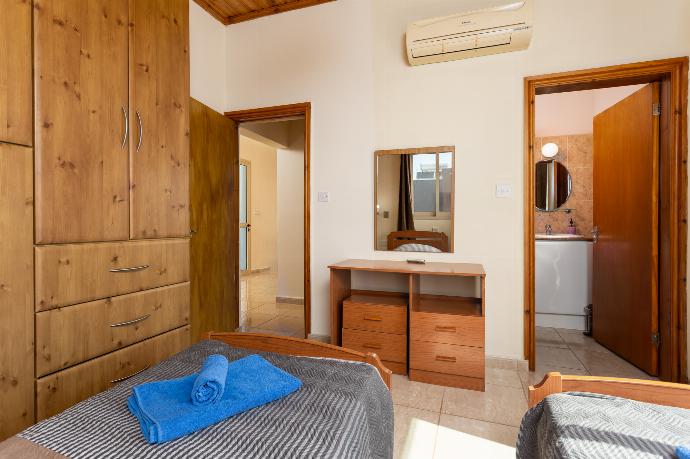 Twin bedroom on first floor with en suite bathroom, A/C, sea views, and balcony access . - Villa Solon . (Photo Gallery) }}