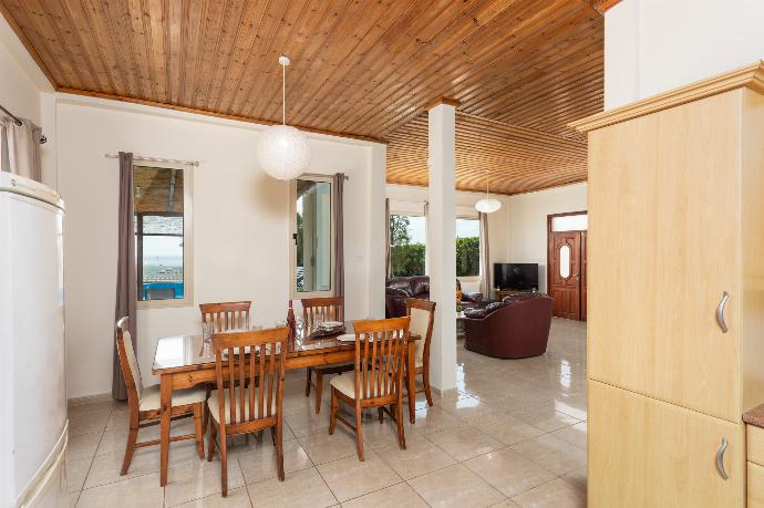 Open-plan living room with sofas, dining area, kitchen, WiFi internet, satellite TV, and sea views . - Villa Aristotle . (Galleria fotografica) }}