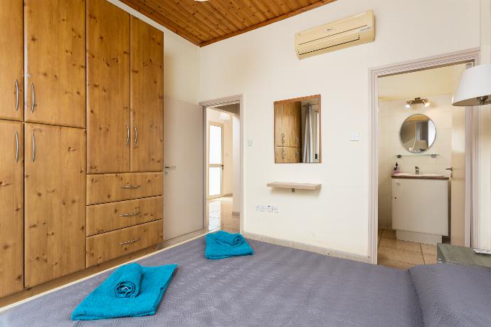 Double bedroom with en suite bathroom, A/C, and balcony access . - Villa Archimedes . (Photo Gallery) }}