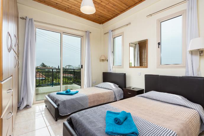 Twin bedroom with A/C and balcony access . - Villa Archimedes . (Photo Gallery) }}