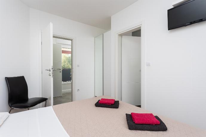 Double bedroom with en suite bathroom, A/C, and TV . - Villa Krnica . (Photo Gallery) }}