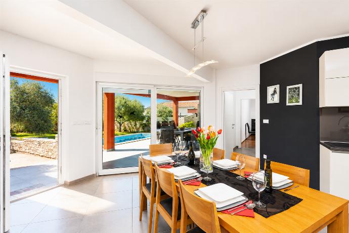 Open-plan living room with sofa, dining area, kitchen, A/C, WiFi internet, and satellite TV . - Villa Krnica . (Photo Gallery) }}