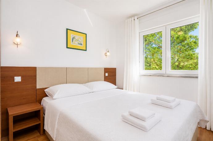 Double bedroom with en suite bathroom, A/C, and TV . - Villa Krnica . (Photo Gallery) }}