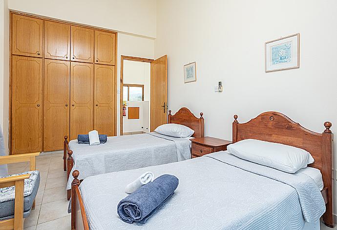 Twin bedroom with A/C, sea views, and balcony access . - Blue Bay Villa Nicole . (Галерея фотографий) }}