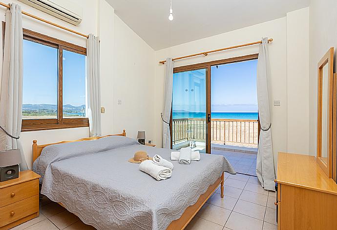 Double bedroom with A/C, sea views, and balcony access . - Blue Bay Villa Thea . (Photo Gallery) }}