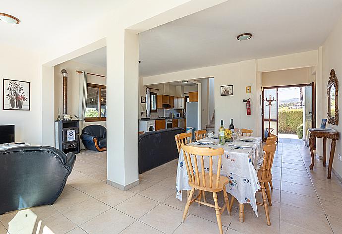 Open-plan living room with sofas, dining area, kitchen, A/C, WiFi internet, and satellite TV . - Blue Bay Villa Dimitris . (Photo Gallery) }}