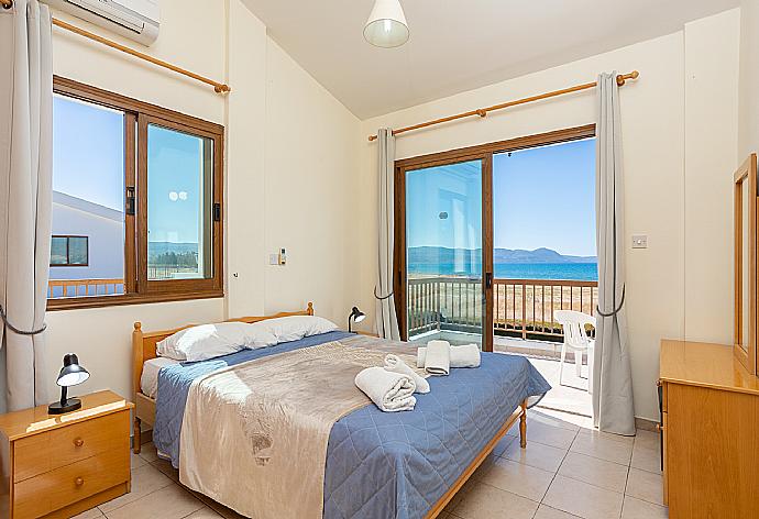 Double bedroom with A/C, sea views, and balcony access . - Blue Bay Villa Dimitris . (Galería de imágenes) }}